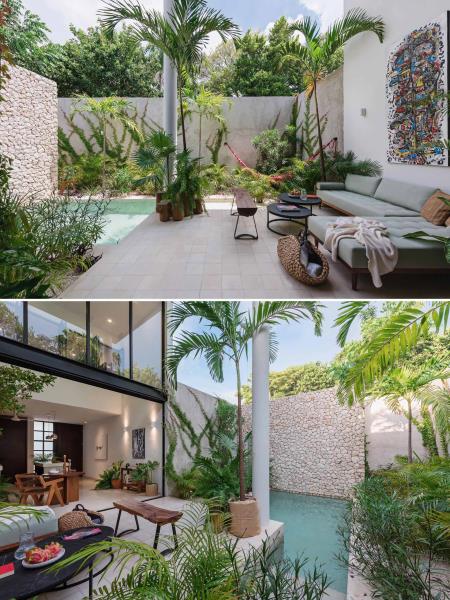 Небольшой дом с открытой гостиной, тропическими растениями и небольшим бассейном.