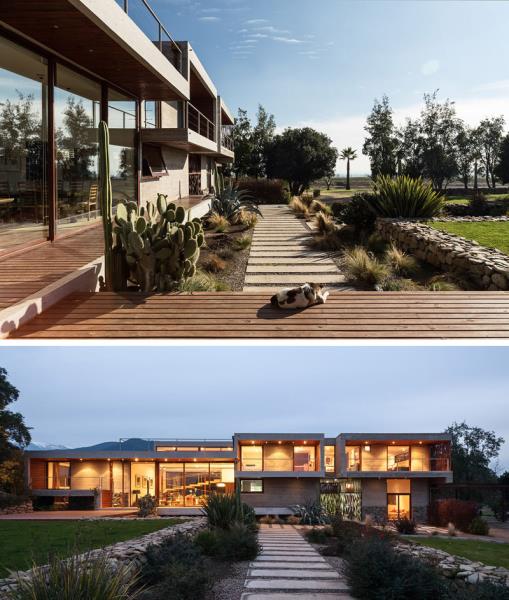 Две полосы бетонной брусчатки создают дорожки позади этого современного дома, определяя различные участки двора.