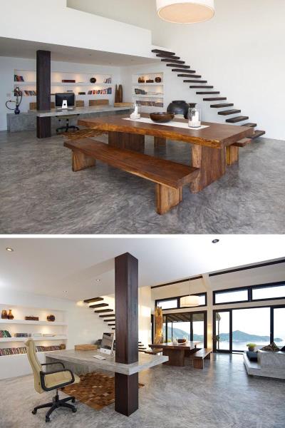 Изготовленный на заказ бетонный стол использует деревянную колонну в качестве опоры в этом домашнем офисе.