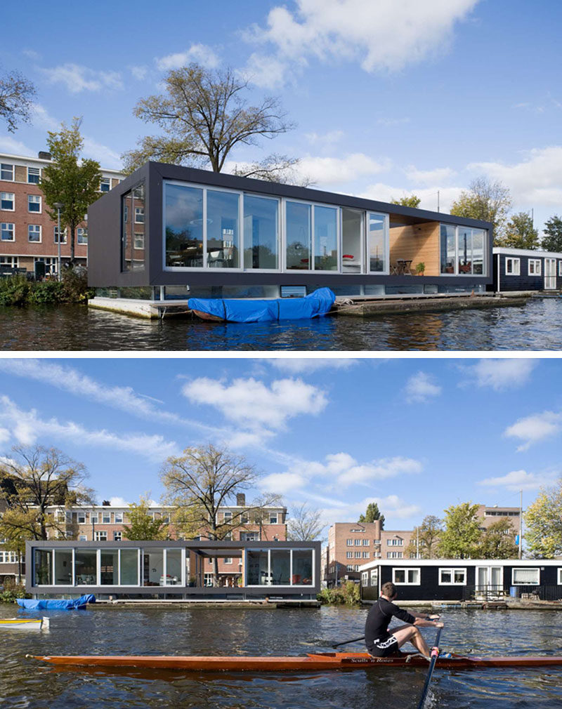 11 потрясающих примеров современных домашних лодок // Большие окна от пола до потолка и большая открытая площадка обеспечивают этому плавучему дому много естественного света и беспрепятственный вид на реку.