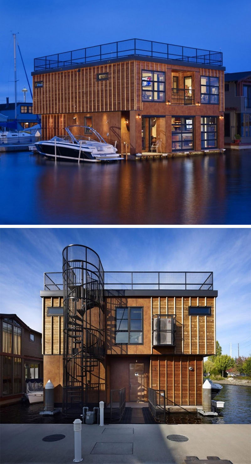 11 потрясающих примеров современных домашних лодок // Этот двухэтажный плавучий дом имеет террасу на крыше, на которую можно подняться по винтовой лестнице первого этажа.