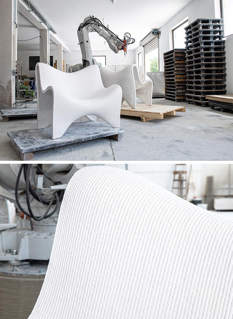 Пара напечатанных на 3D-принтере садовых стульев из бетона.