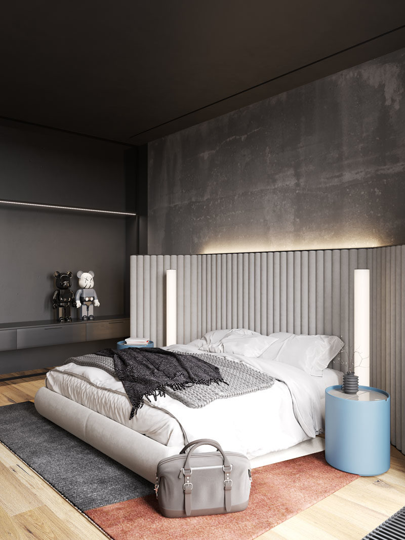 Идеи для спальни - в этой современной спальне бетонные стены были оставлены голыми, а скрытое освещение за изголовьем придает комнате мягкое сияние. #BedroomIdeas # ModernBedroom # BacklitHadboard