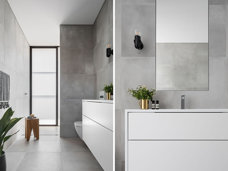 В этой ванной комнате использована простая серо-белая цветовая палитра для создания современного и успокаивающего внешнего вида. # Современная ванная # Дизайн ванной