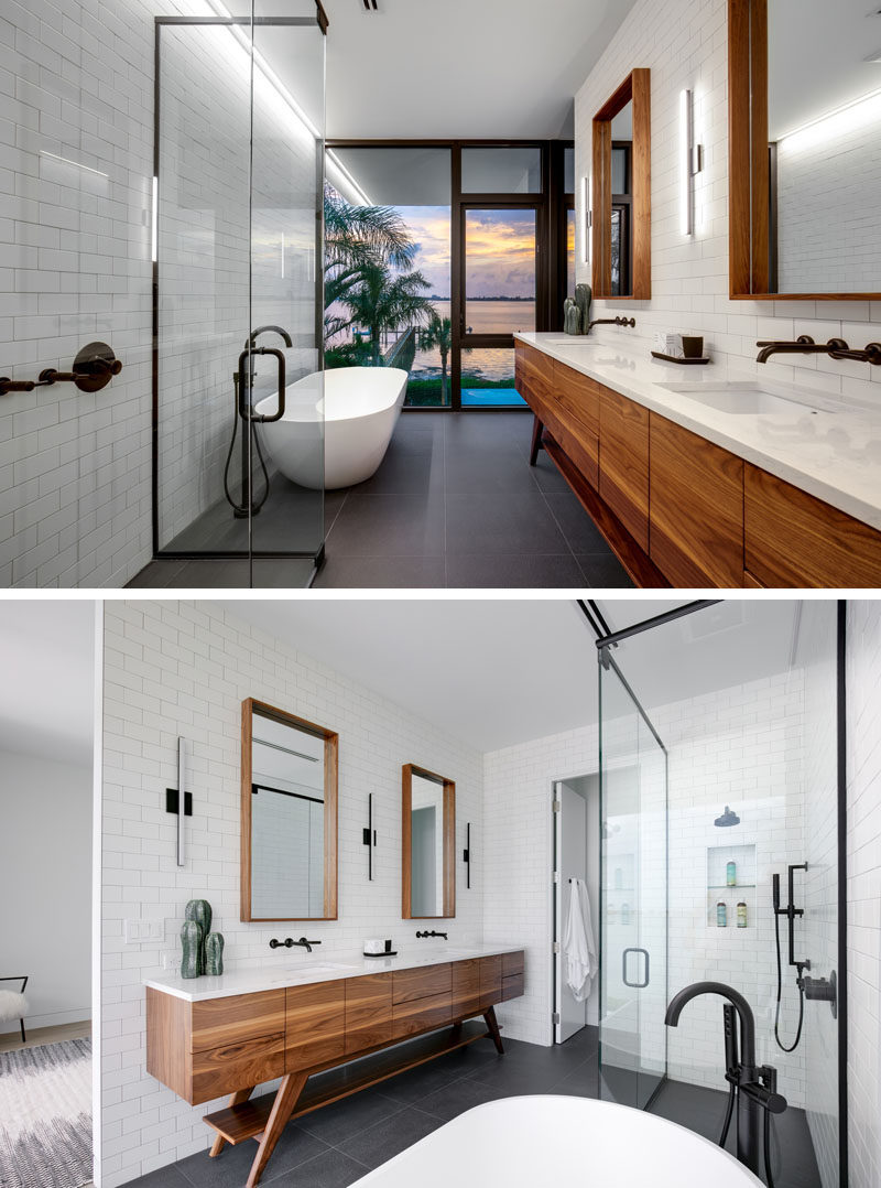 В этой современной ванной комнате есть отдельная ванная комната, которая открывается вид на воду, а зеркала в деревянной раме и деревянный туалетный столик добавить естественности бело-серой ванной комнаты. # Современная ванная # Дизайн ванной