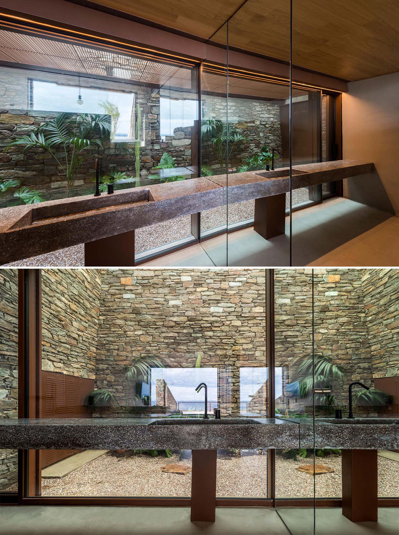 В этой ванной комнате стеклянная стена обеспечивает вид на сад и каменную стену.