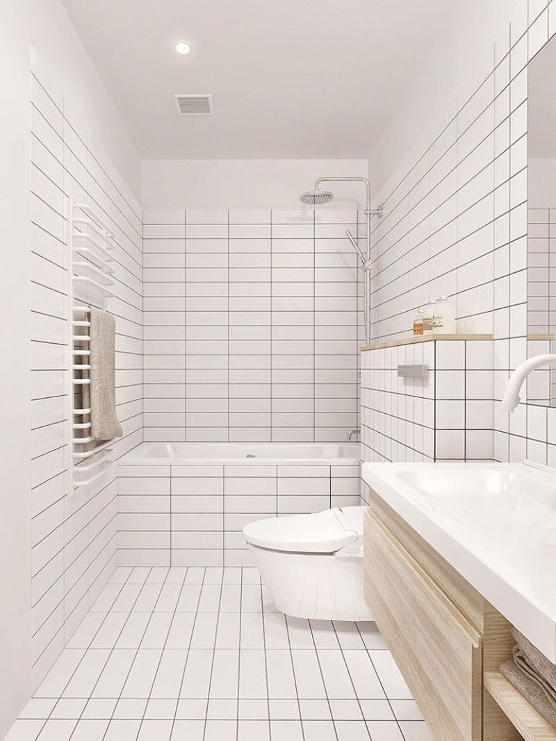 Идея плитки для ванной - используйте одну и ту же плитку на полу и стенах | Белая квадратная и прямоугольная плитка покрывает пол и часть стен этой ванной комнаты, придавая ей чистый современный вид.