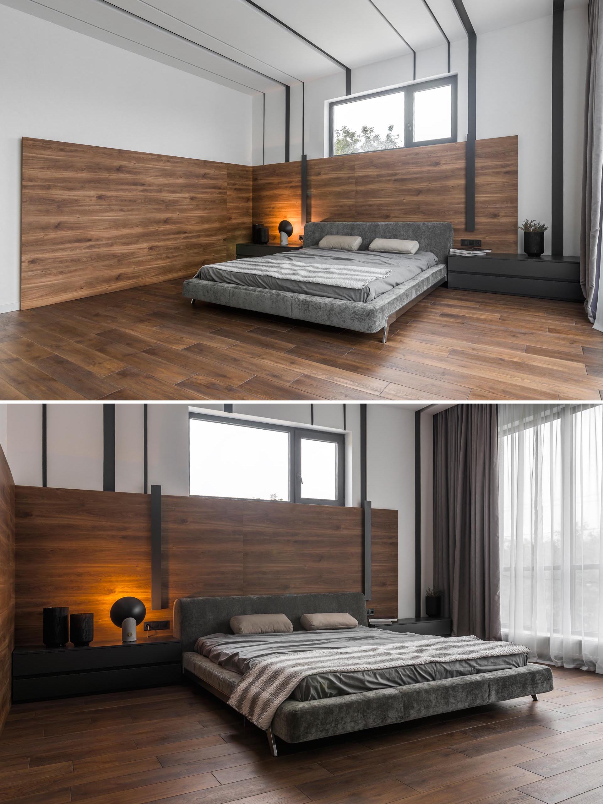 Современная спальня с деревянной акцентной стеной.