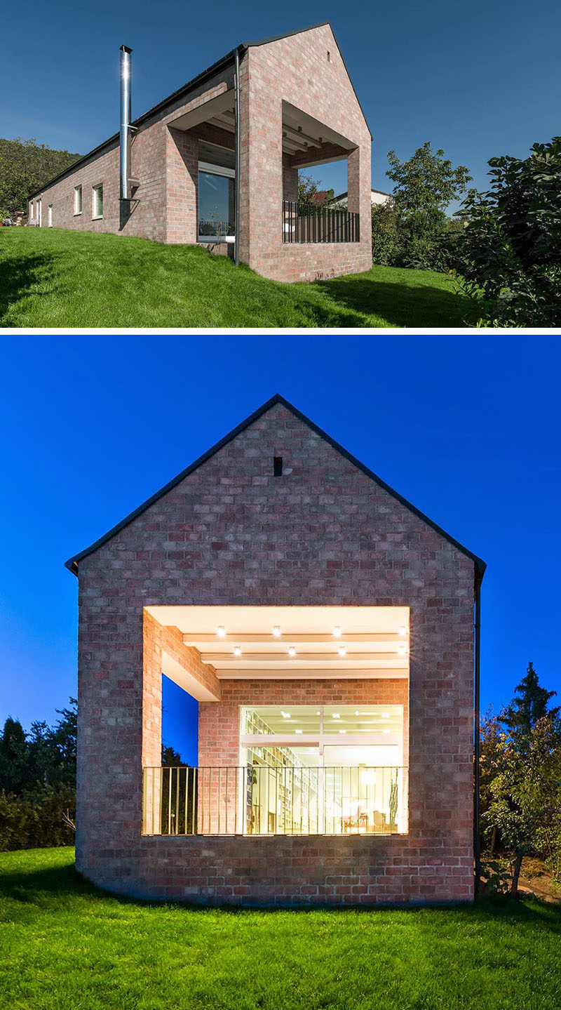 Кирпичная кладка этого дома придает ему традиционный вид, а остроконечная крыша сохраняет дизайн минималистичным и современным.