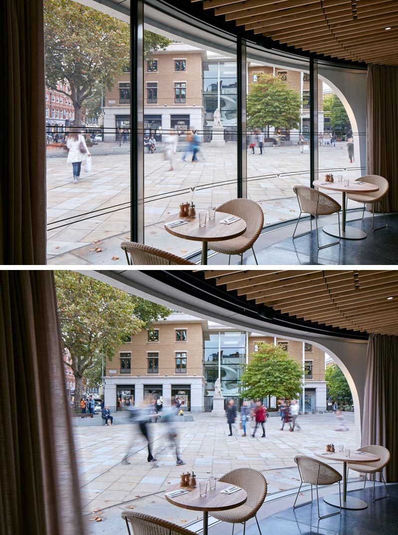 Широкие изгибы больших стеклянных окон могут быть открыты, чтобы соединить интерьер первого этажа ресторана с площадью. #Windows #RestaurantWindows #CurvedWindows