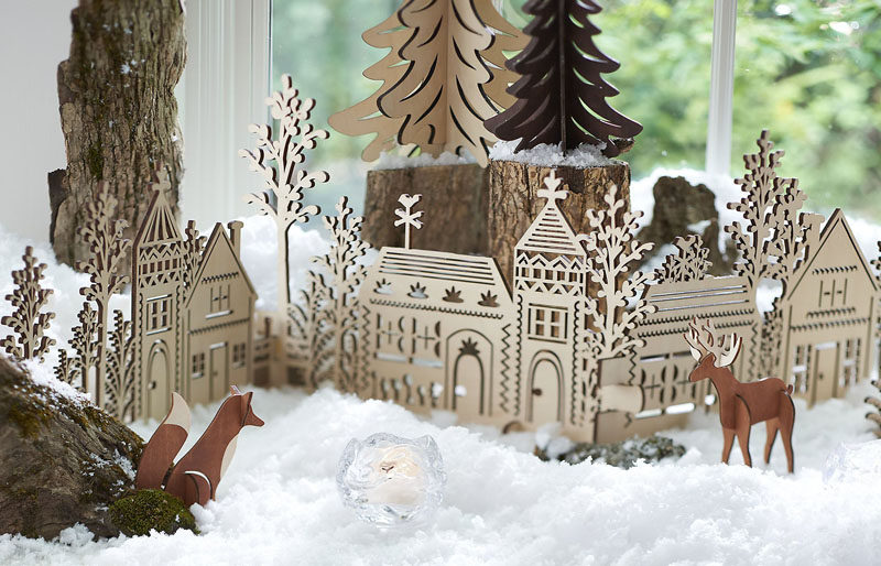 30 современных идей рождественского декора для вашего дома // Эта замысловатая деревянная деревня добавляет скандинавский элемент к вашей обстановке и помогает сохранить естественность вашего декора.
