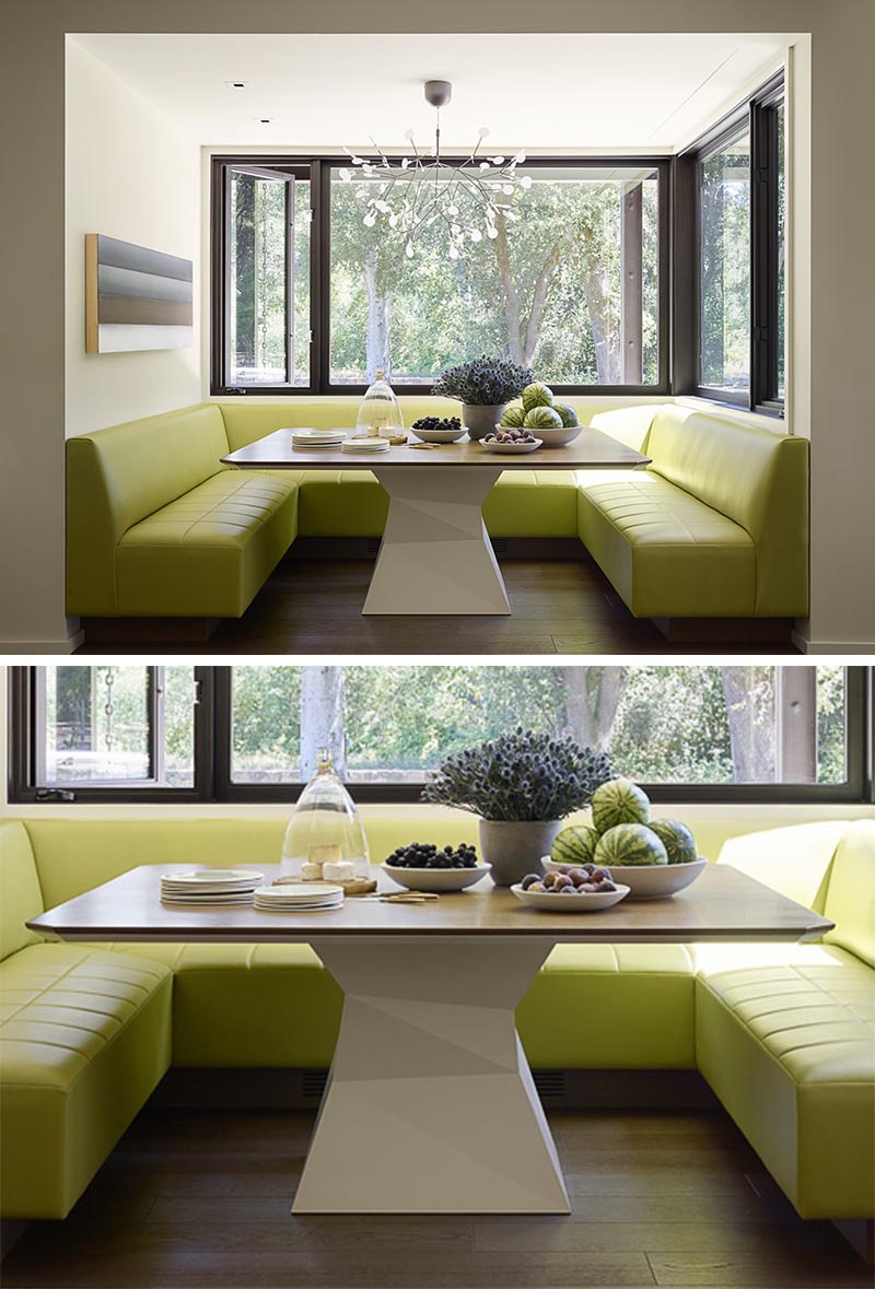 Встроенный обеденный уголок с банкетными сиденьями по периметру салатового цвета.