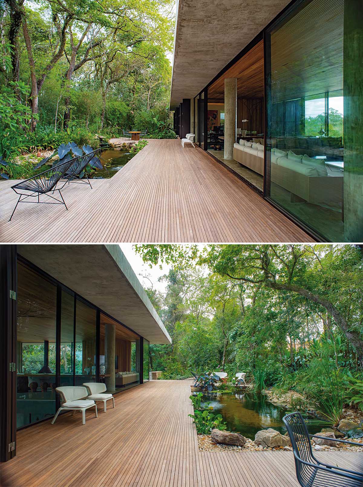 Современный бетонный дом с деревянной террасой, огибающей естественный водоем, и видом на деревья.