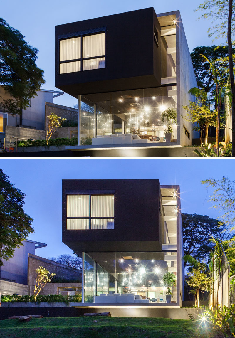FGMF Arquitetos спроектировали этот современный дом в Сан-Паулу, Бразилия, для молодой семьи, которая находится на крутом склоне с видом на город 