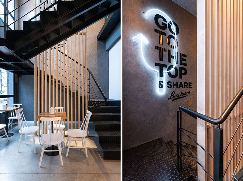В этом современном кафе есть черная стальная лестница с деревянным акцентом и неоновым освещением, которая ведет клиентов на крышу. # Лестница # Кафе # Неоновое освещение