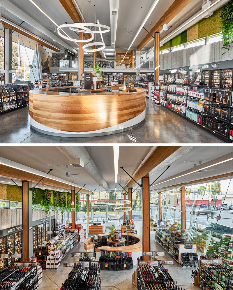 Дегустационный бар изогнутого дерева расположен в центре этого современного винного магазина. #TastingBar #RetailDesign #InteriorDesign #LiquorStore