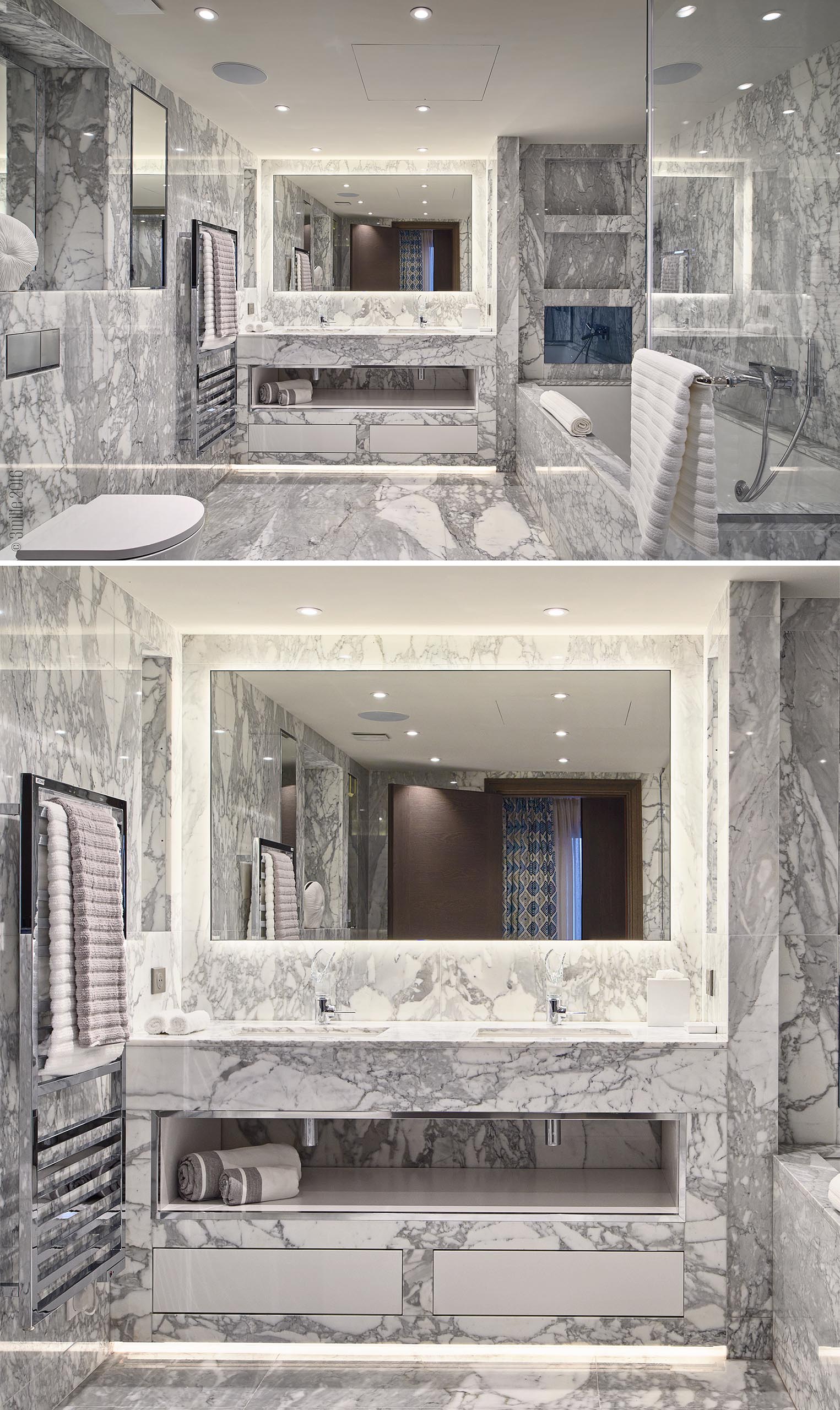 Ванная комната, стены и пол выложены серым и белым камнем.