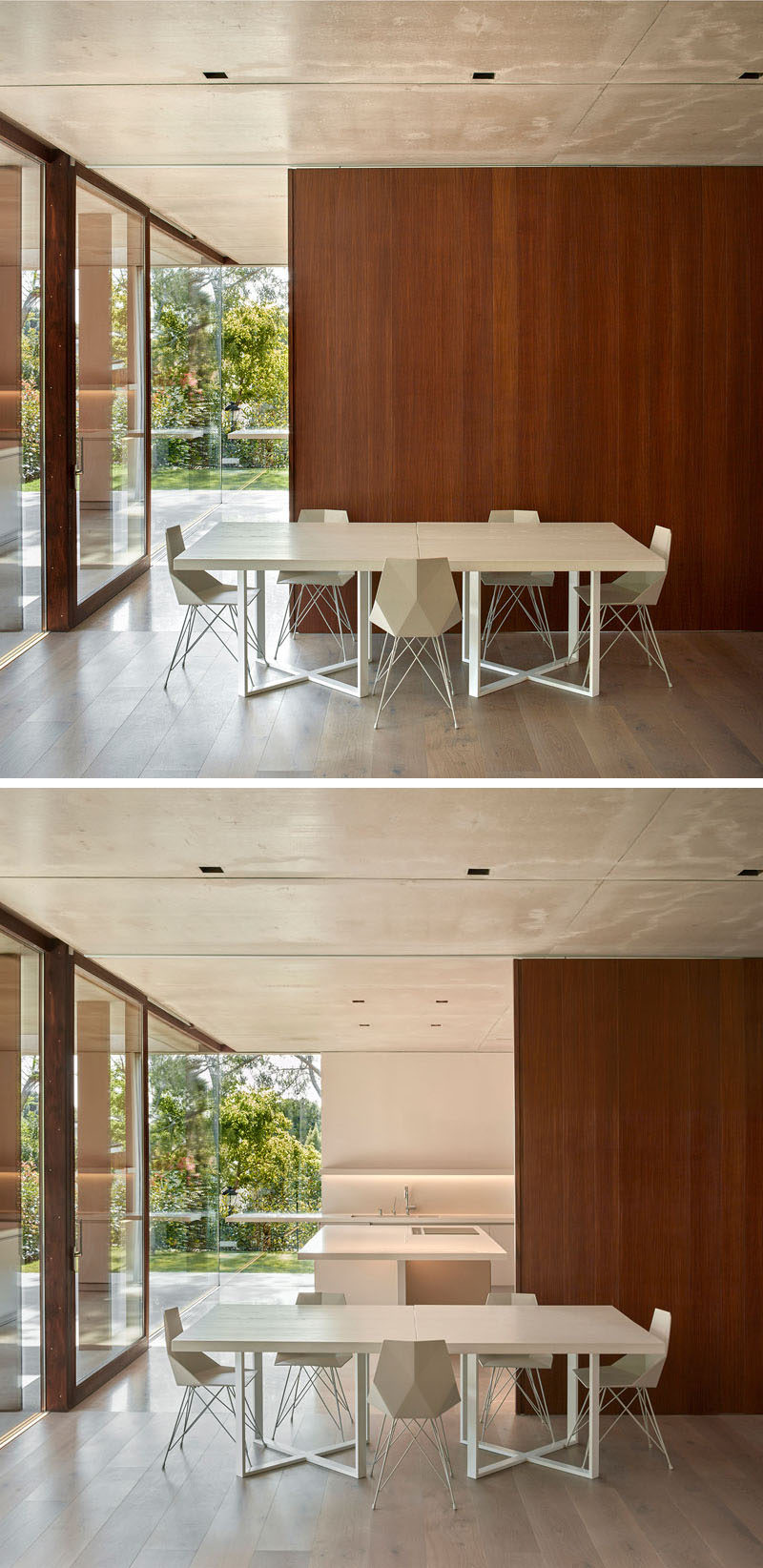 Эта столовая имеет минималистичный дизайн с белым столом и стульями, а деревянная стена раздвигается, открывая кухню позади нее.
