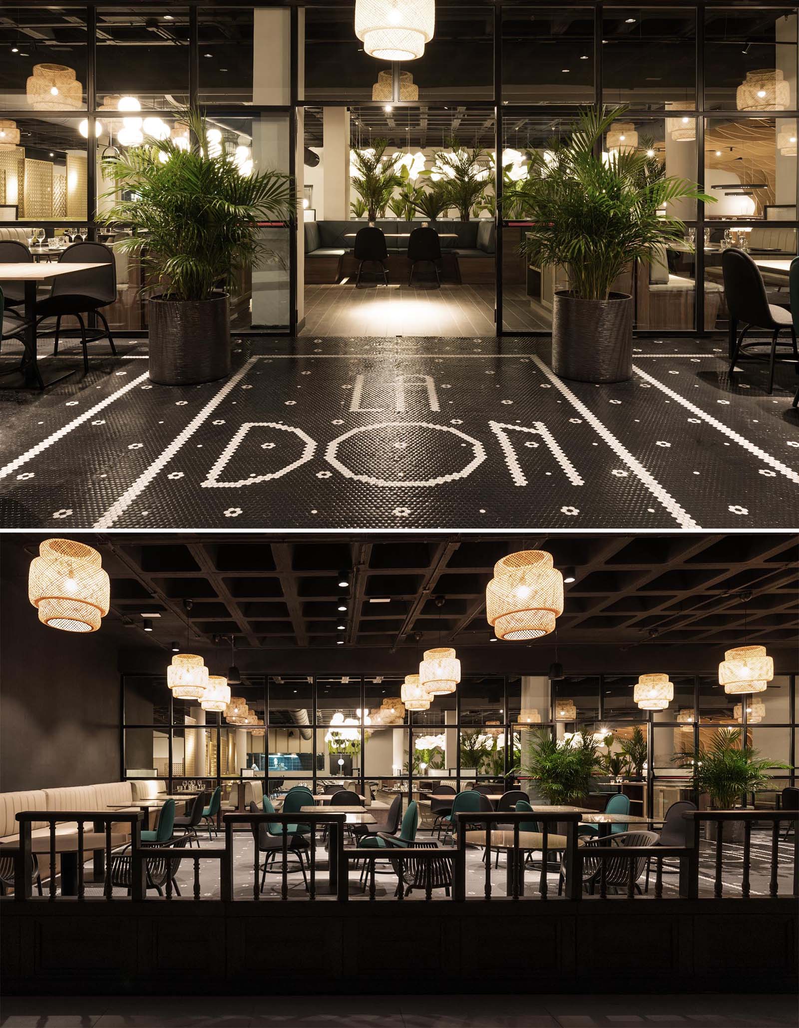 Современный ресторан, название которого написано черно-белой плиткой на полу.