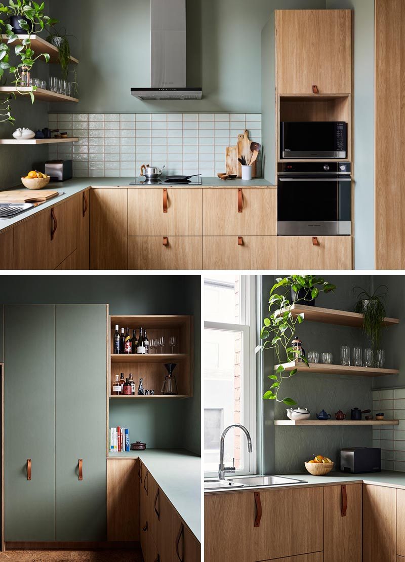 Эта современная кухня сочетает в себе деревянные шкафы с кожаными ручками, а также зеленые стены с белым фартуком. #ModernKitchen #GreenWalls # WoodCabinets