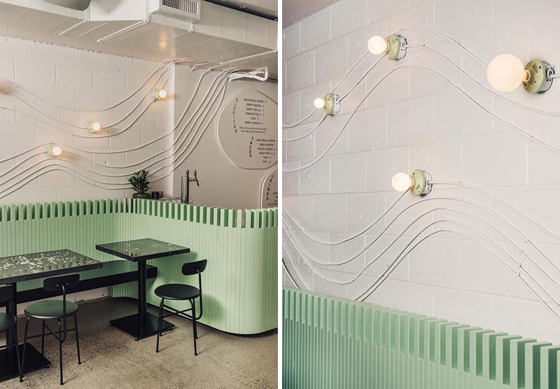 Для создания волнообразных настенных рисунков в дизайне этого ресторана использовался электрический кабель.